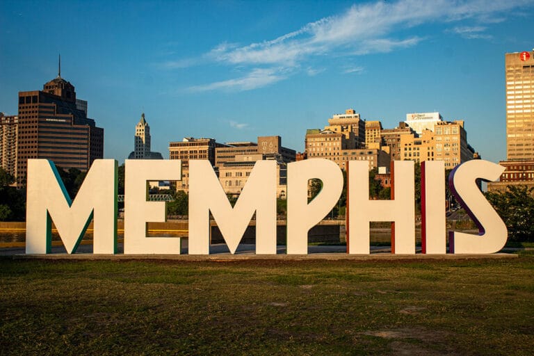 Sign that says Memphis in individual letters. In front of downtown.